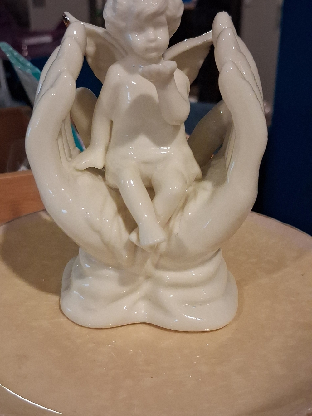 White Ceramic Cherub Figurine Cradled in Hands - Decorative Accent